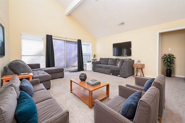 carpeted living room with high vaulted ceiling and beam ceiling