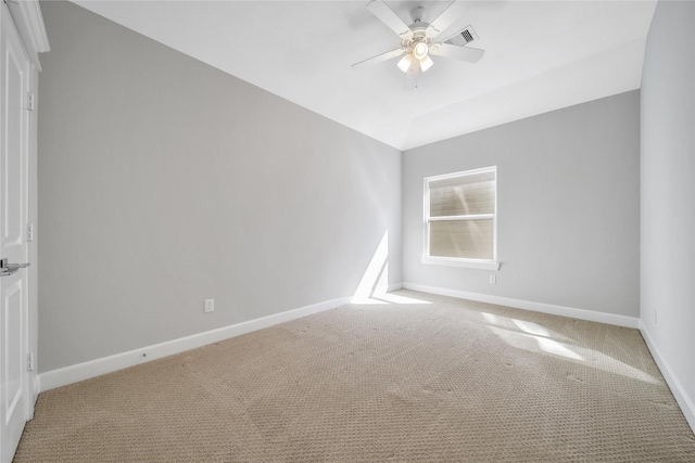 unfurnished room featuring lofted ceiling, light colored carpet, ceiling fan, and baseboards