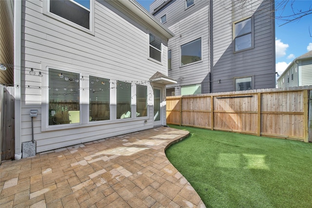 view of yard featuring a patio area and fence