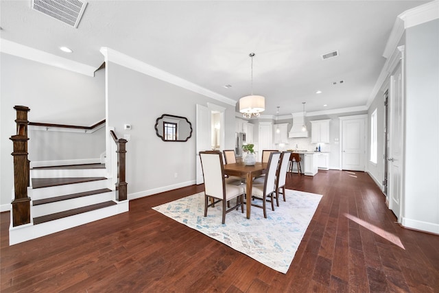 dining space featuring dark wood-style floors, stairway, visible vents, and crown molding