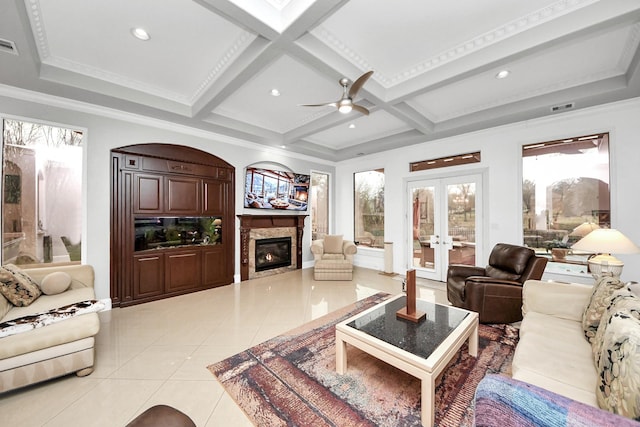 tiled living room with beamed ceiling, crown molding, french doors, and coffered ceiling