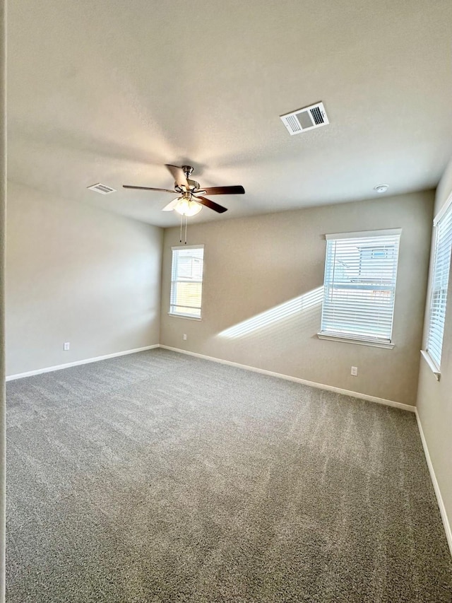 unfurnished room featuring carpet and ceiling fan