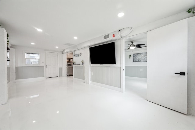 unfurnished living room featuring recessed lighting, wainscoting, visible vents, and ceiling fan