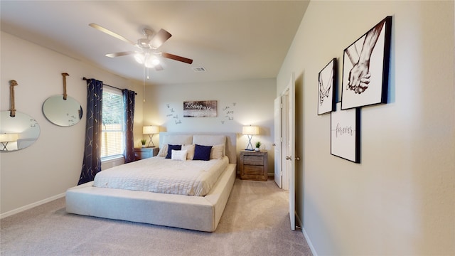 bedroom featuring light carpet and ceiling fan