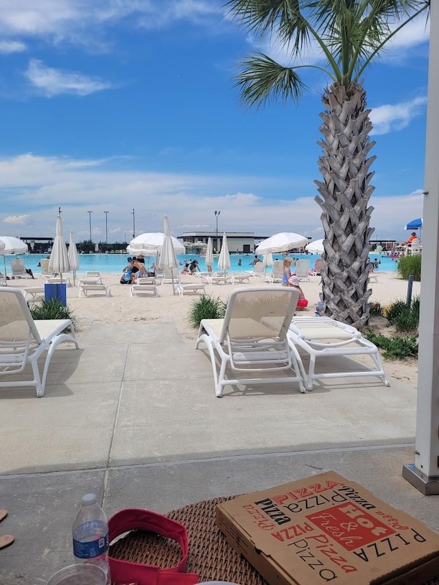 view of patio featuring a water view