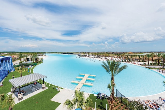 birds eye view of property with a water view