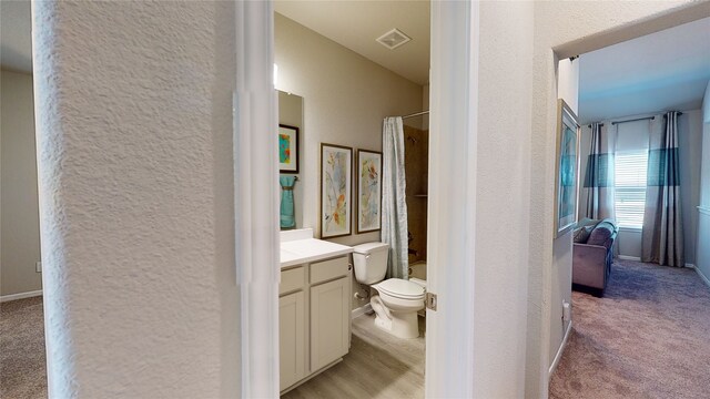 26356 Cooperstown Way, Splendora, TX 77372 - bathroom with vanity, visible vents, baseboards, toilet, and a textured wall