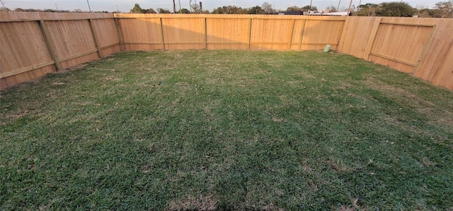 view of yard featuring a fenced backyard