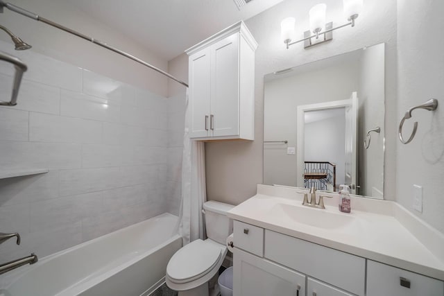 full bath with toilet, shower / bath combo, and vanity