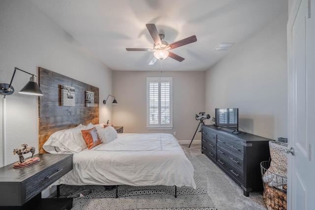 bedroom with baseboards, visible vents, a ceiling fan, and light colored carpet