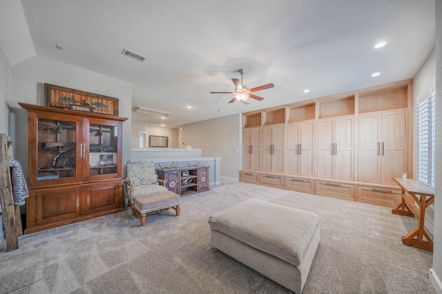 living area featuring a ceiling fan, carpet, visible vents, and recessed lighting