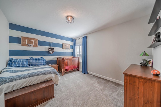 bedroom featuring light carpet and baseboards