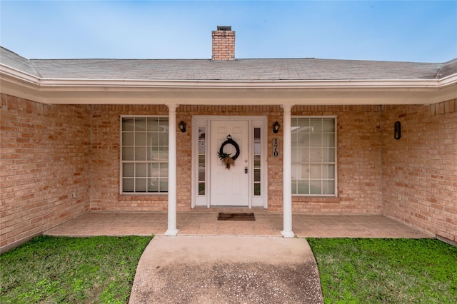 property entrance featuring a patio