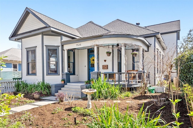 view of front of house with covered porch and roof with shingles