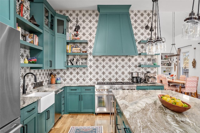 kitchen featuring open shelves, exhaust hood, light stone countertops, and stainless steel appliances