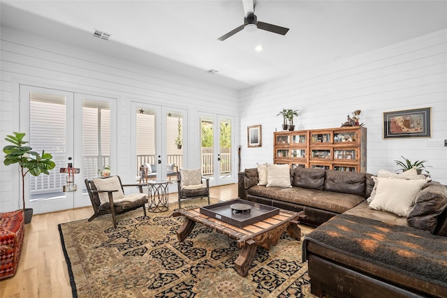 living room featuring visible vents, light wood-style flooring, recessed lighting, ceiling fan, and french doors