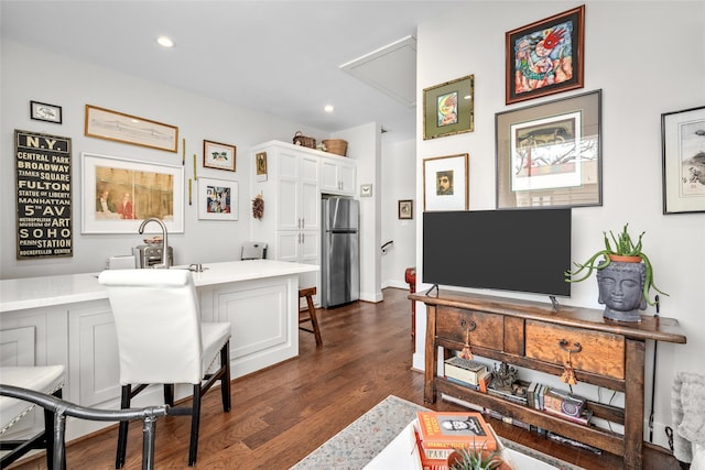 interior space with dark wood finished floors and recessed lighting