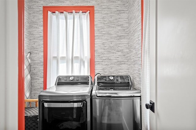 clothes washing area featuring laundry area and independent washer and dryer