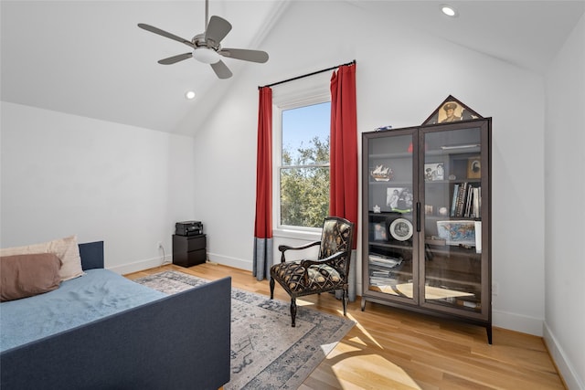 bedroom featuring recessed lighting, baseboards, lofted ceiling, and wood finished floors