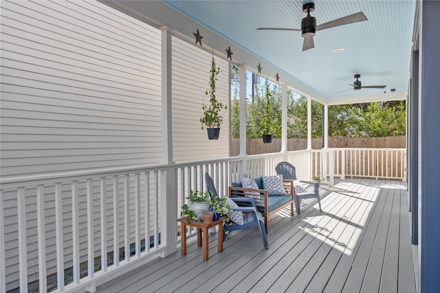 sunroom featuring ceiling fan