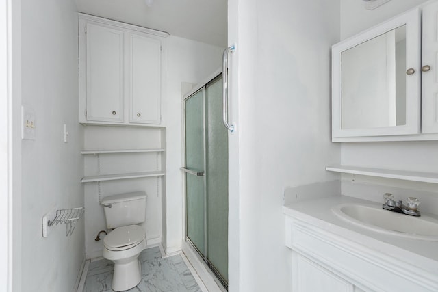 bathroom featuring toilet, vanity, and walk in shower