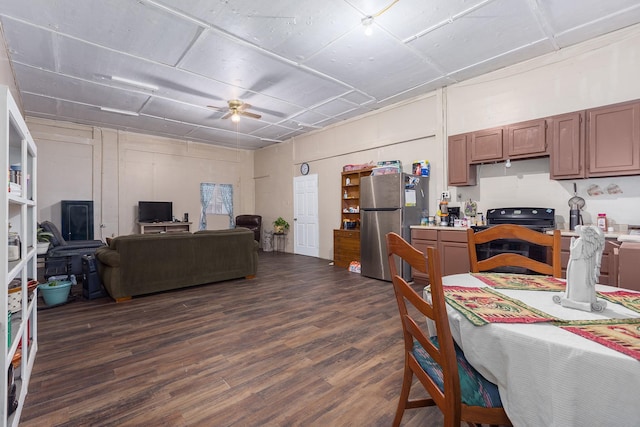 kitchen featuring ceiling fan, black electric range, dark hardwood / wood-style floors, and stainless steel refrigerator