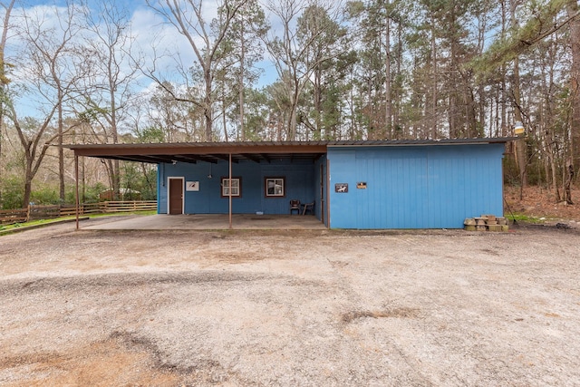 garage featuring a carport