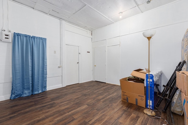 basement with dark wood-type flooring