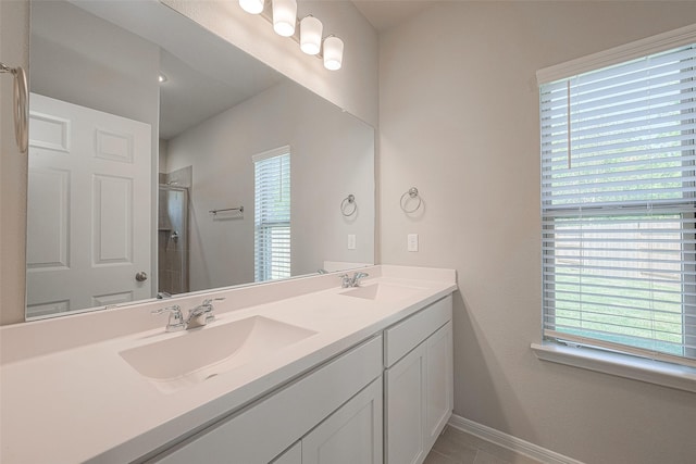 bathroom featuring vanity and an enclosed shower