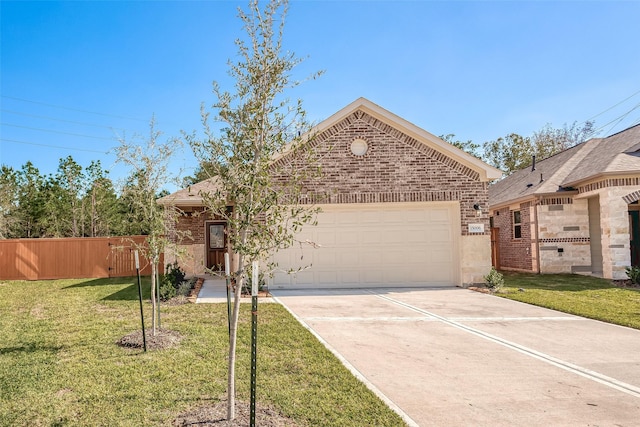 view of front of house featuring a front yard and a garage