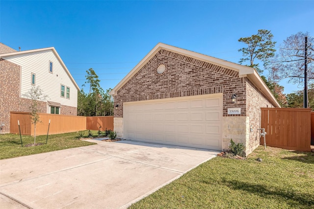 view of front facade featuring a garage, a front lawn, and an outdoor structure