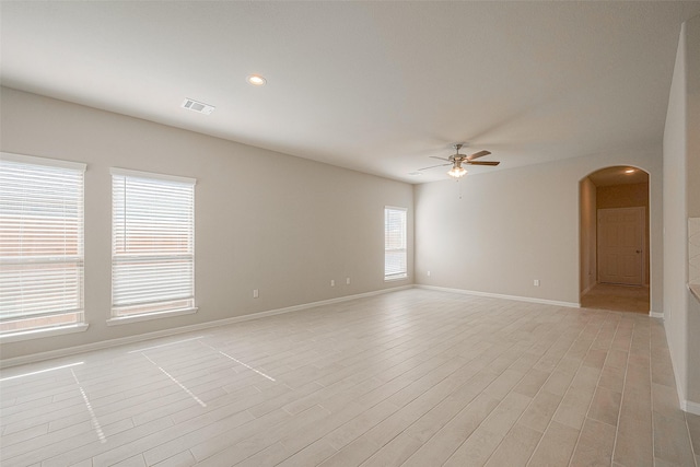 empty room featuring light hardwood / wood-style floors and ceiling fan