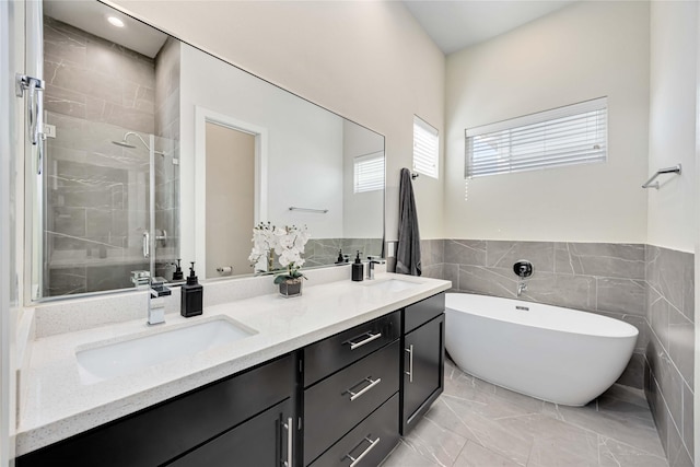 108 Knightsbridge Park Ln, Houston, TX 77018 - bathroom with plus walk in shower, tile walls, and vanity