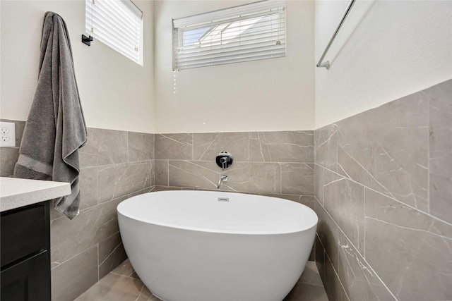 108 Knightsbridge Park Ln, Houston, TX 77018 - bathroom with tile walls, vanity, tile patterned flooring, and a bath