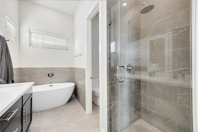 108 Knightsbridge Park Ln, Houston, TX 77018 - full bathroom with toilet, plus walk in shower, tile walls, and vanity