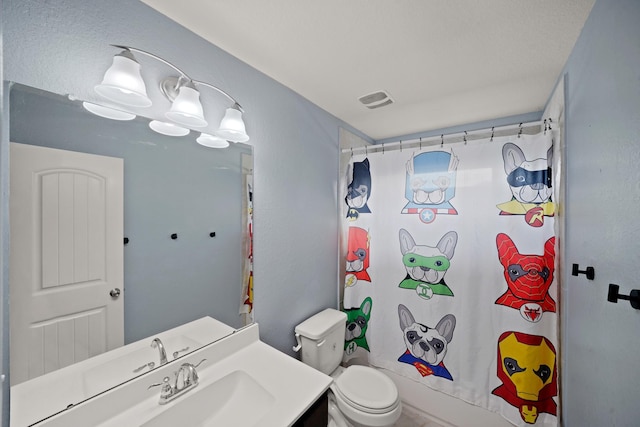 full bath featuring toilet, visible vents, and vanity