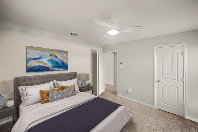 bedroom with baseboards, visible vents, ceiling fan, and light colored carpet