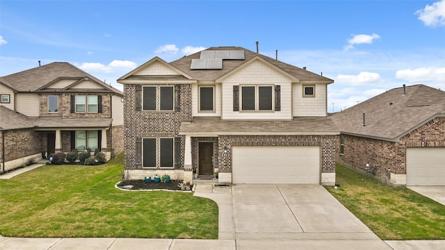 craftsman house with driveway, a garage, roof mounted solar panels, a front lawn, and brick siding