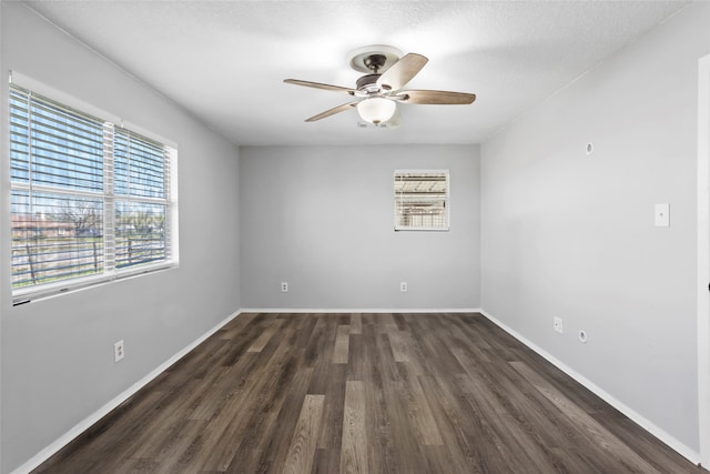 spare room with a healthy amount of sunlight, baseboards, and ceiling fan