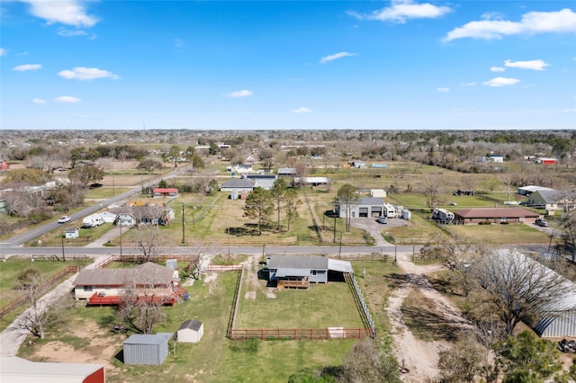 birds eye view of property with a rural view