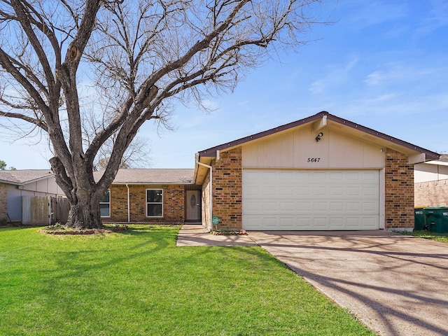 single story home featuring a front yard and a garage