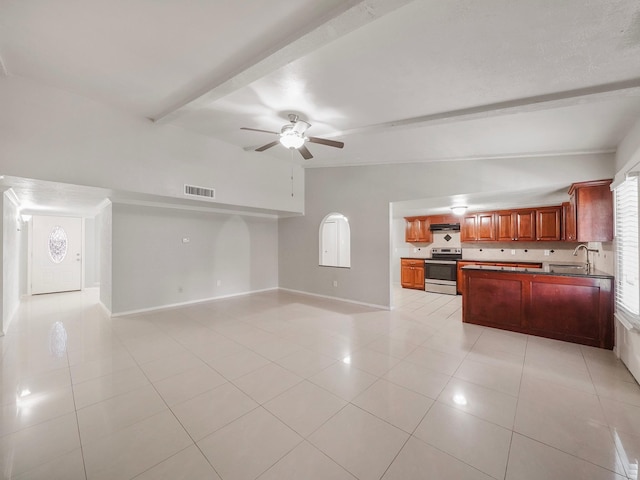 kitchen featuring stainless steel electric range, exhaust hood, light tile patterned flooring, and beam ceiling