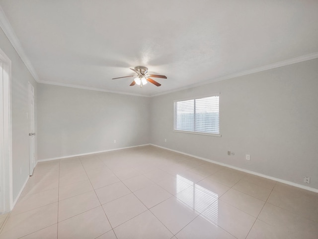 empty room featuring ceiling fan, light tile patterned floors, and crown molding