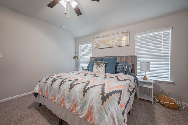 carpeted bedroom with multiple windows, vaulted ceiling, and ceiling fan