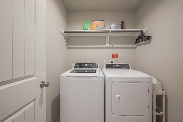 laundry area featuring washing machine and clothes dryer