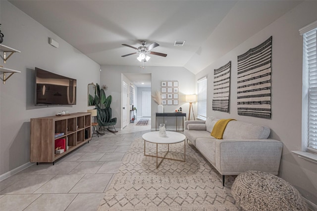 tiled living room featuring vaulted ceiling and ceiling fan