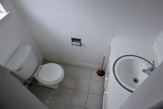 bathroom featuring tile patterned floors, toilet, and sink