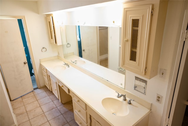bathroom featuring tile patterned flooring and vanity