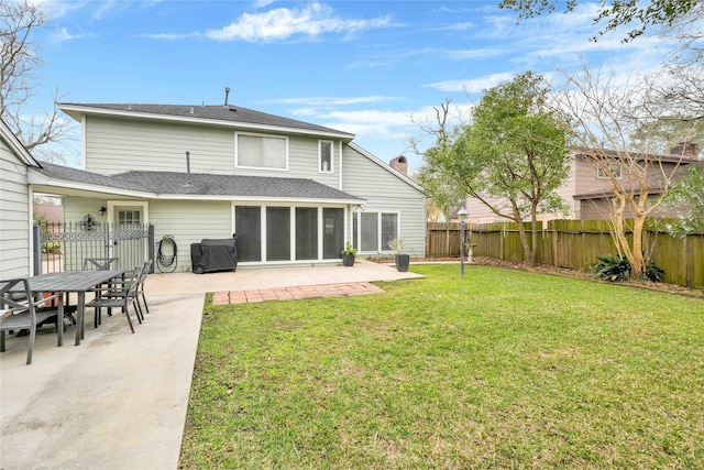 back of property featuring a patio area, a fenced backyard, and a lawn