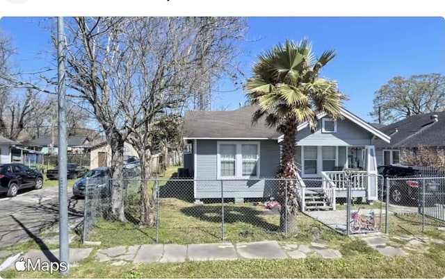 bungalow featuring a fenced front yard